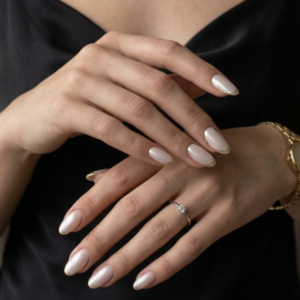 elegant milky nude almond nails with feminine luxury aesthetic and glossy finish