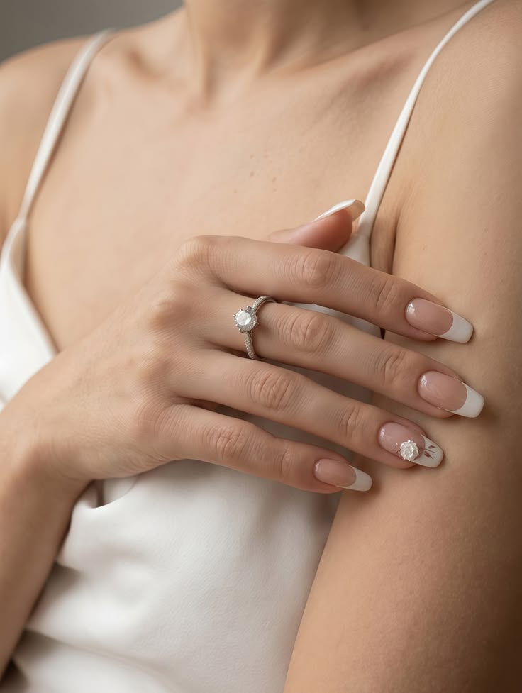 A minimalist single petal floral accent on a soft pink nail, embodying quiet luxury.