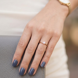 dusty blue glossy nails with cozy chic feminine winter aesthetic