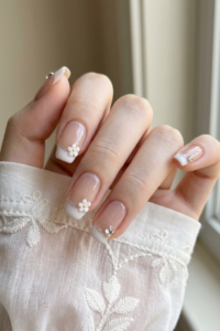 French nails in nude pink, retro style, elegant, sweet and luxurious, French nails with tiny flowers.