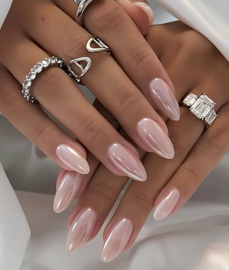 Soft pink nail ideas featuring a pearlescent ballet-slipper glaze for a dreamy feminine finish.