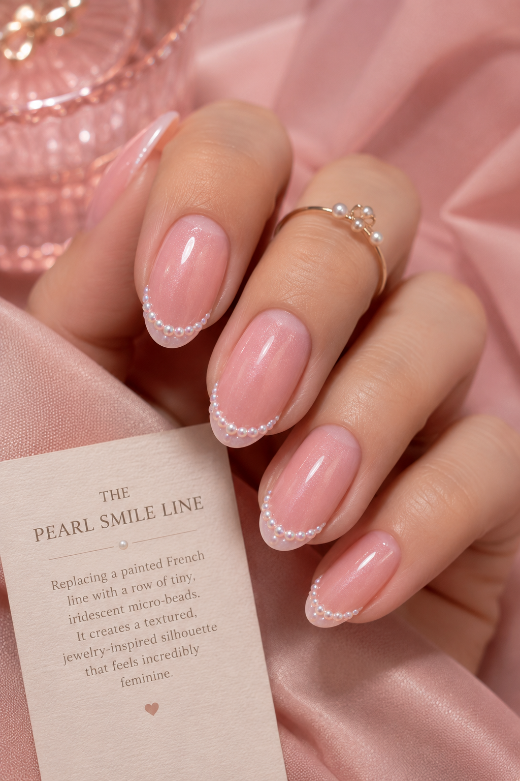 An exquisite pearl smile line manicure, perfect for a quiet luxury and soft pink nail aesthetic.