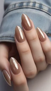 Elegant and youthful glossy almond-shaped nails in milky brown.