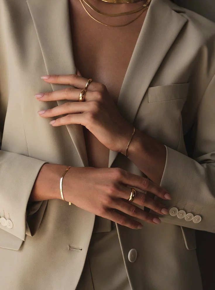 The sophisticated office lady, dressed in a simple yet elegant brown suit, exudes class, refinement, and power.