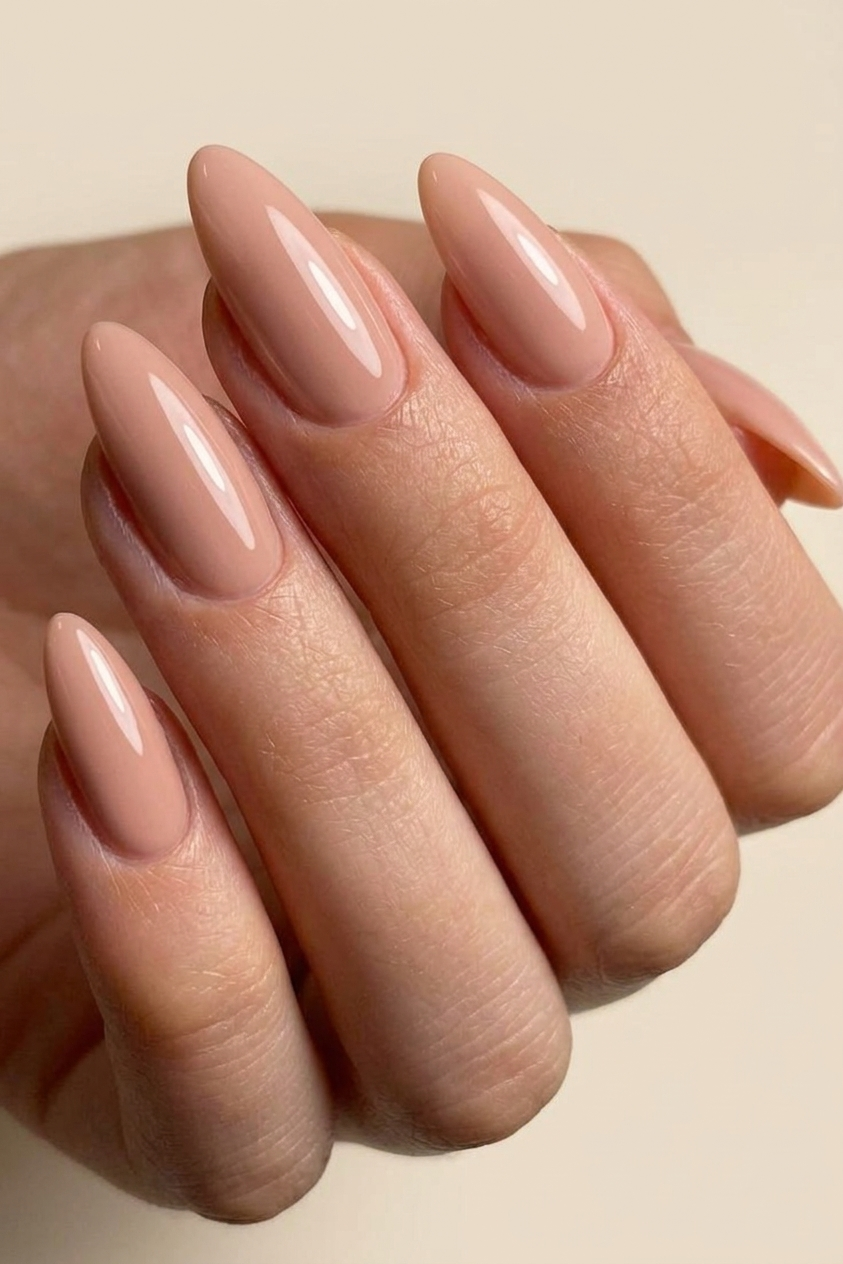 Almond nude nails with a refined finish, elegant summer nails ideas for quiet luxury aesthetic.