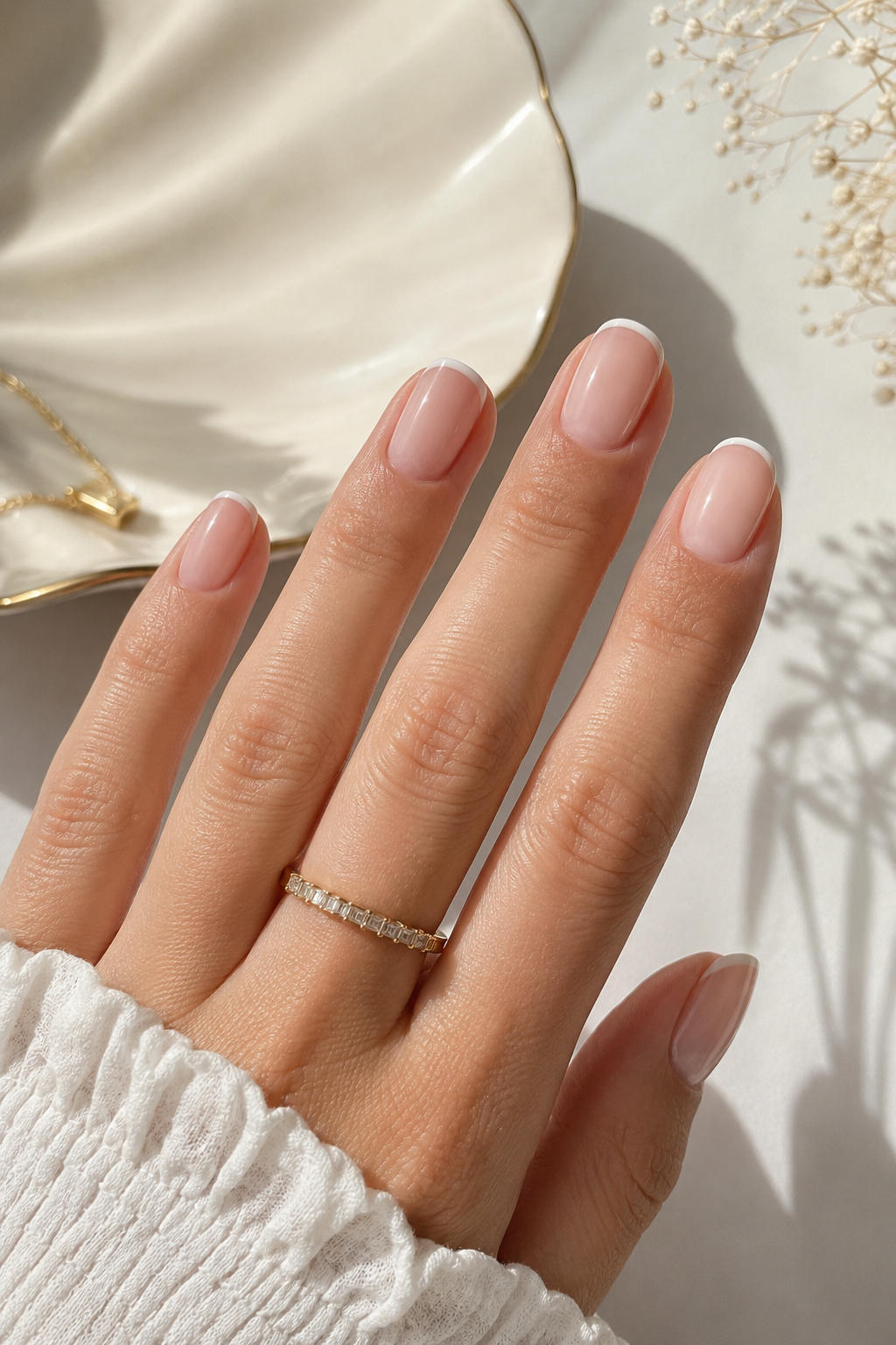 Barely-there French tip nails with a soft white edge and sheer base, elegant feminine summer nails.