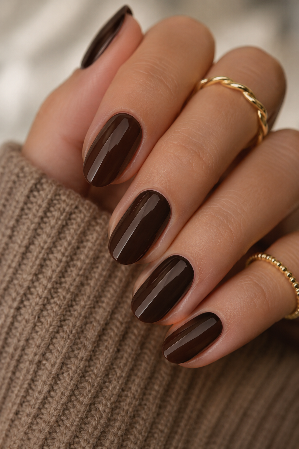 Glossy espresso brown nails featuring one of the most wearable Fall 2026 Nail Colors for cozy chic style.