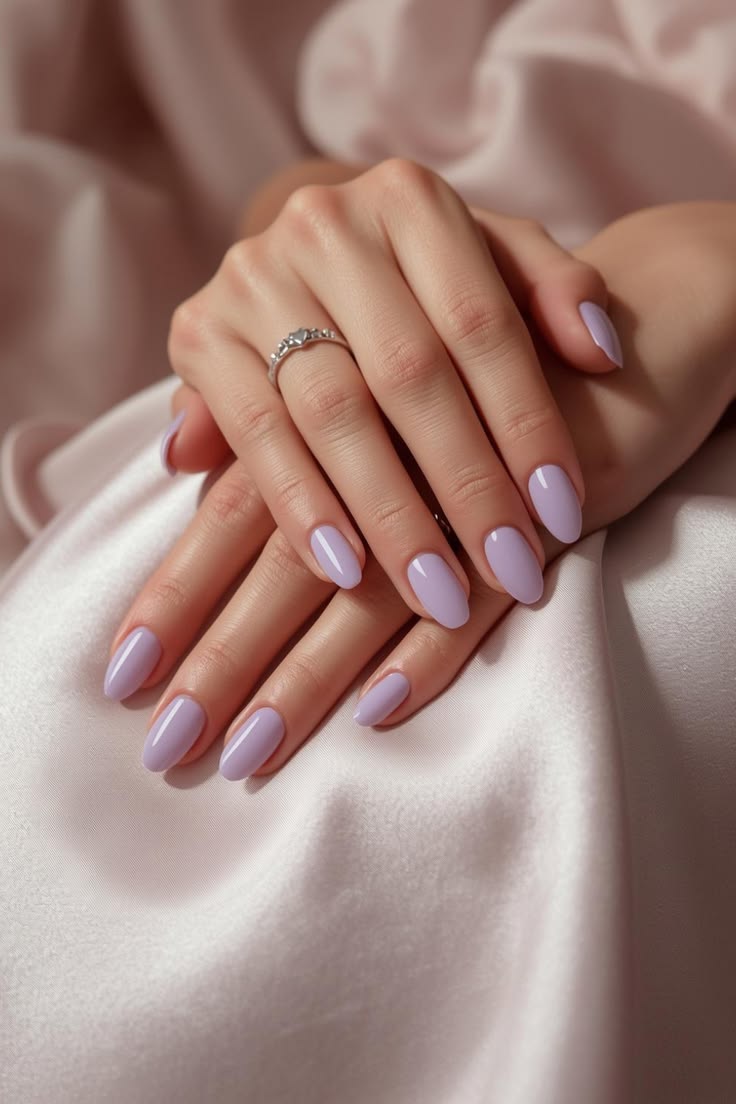 Milky lavender nails with a soft pastel tone, elegant feminine summer nails ideas.