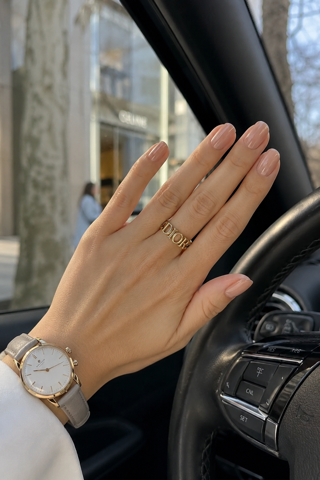 Short almond nail shape in glossy nude polish, the best nail shape for elegant hands with shorter fingers.