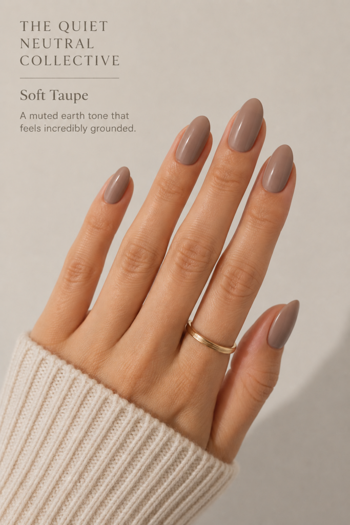 Soft taupe manicure on elegant almond nails, perfectly curated for a grounded and earthy aesthetic.
