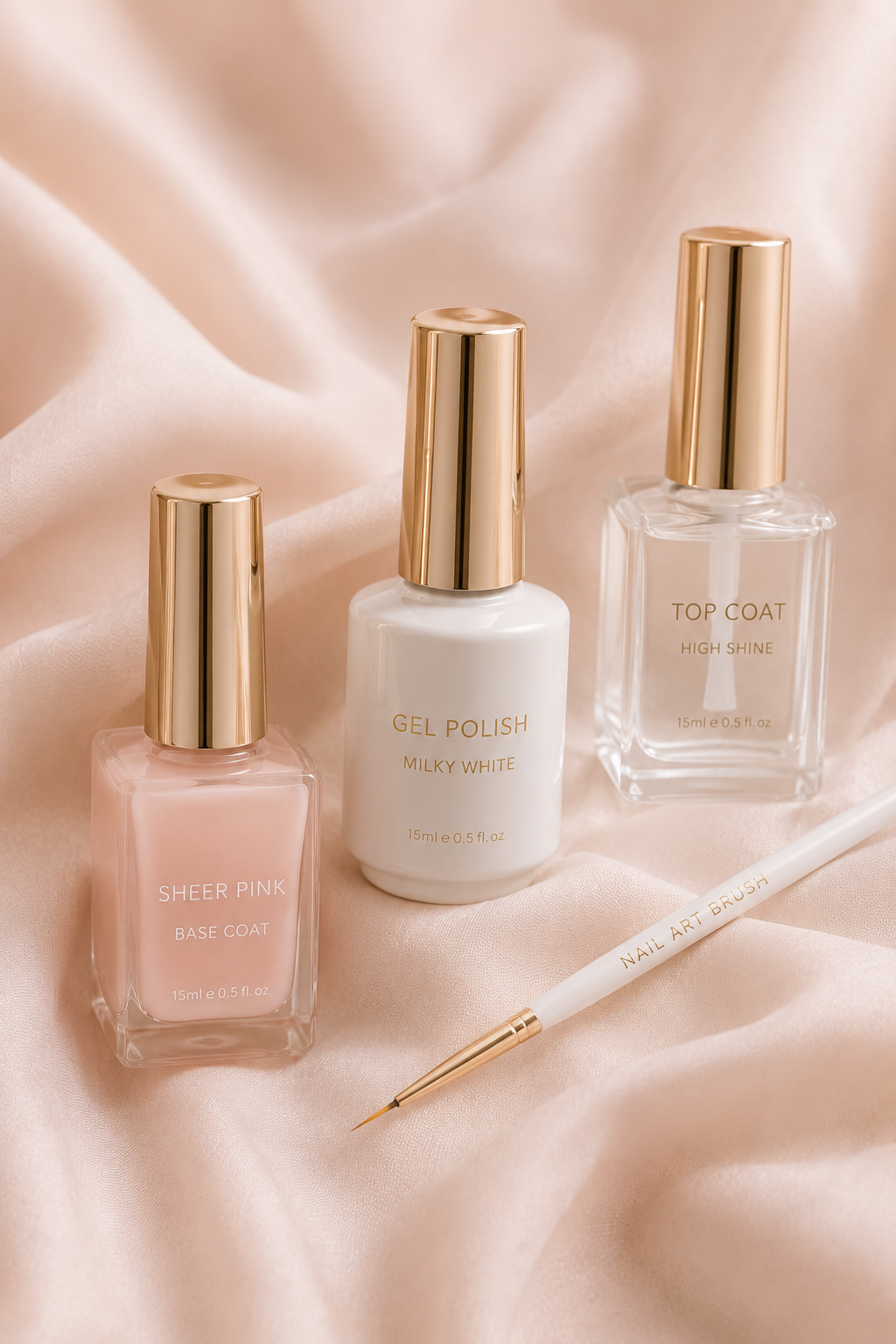 Sheer pink base, white gel polish, and glossy top coat for a micro french manicure styled on soft blush fabric 