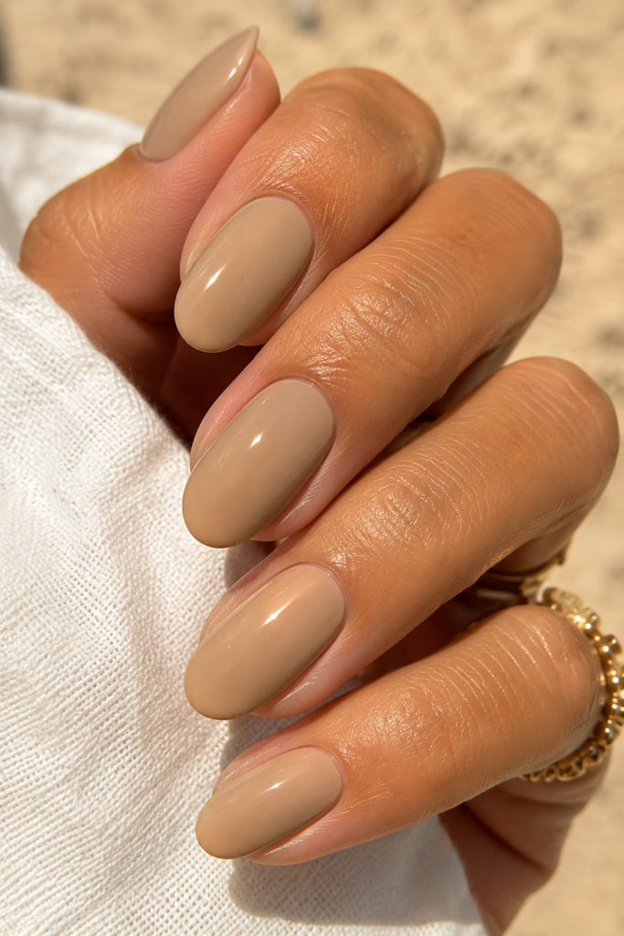 Sun-kissed Warm Sand manicure, a glowing addition to our list of nude nail ideas.