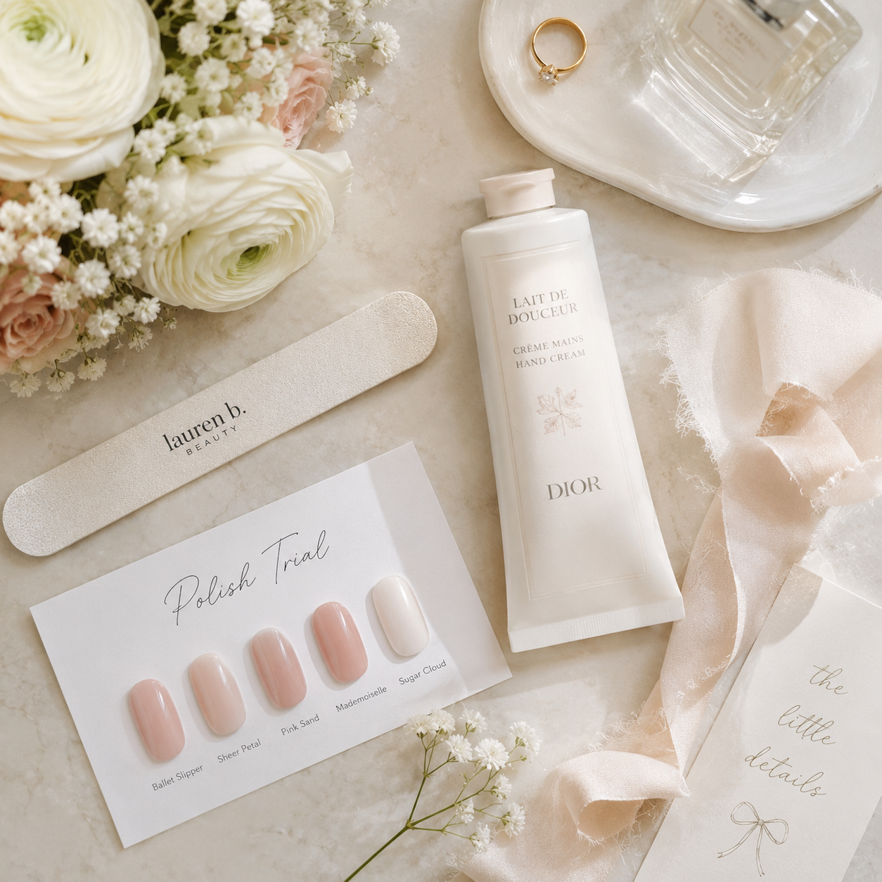 Bridal hand care essentials laid out for a wedding week nail trial run.