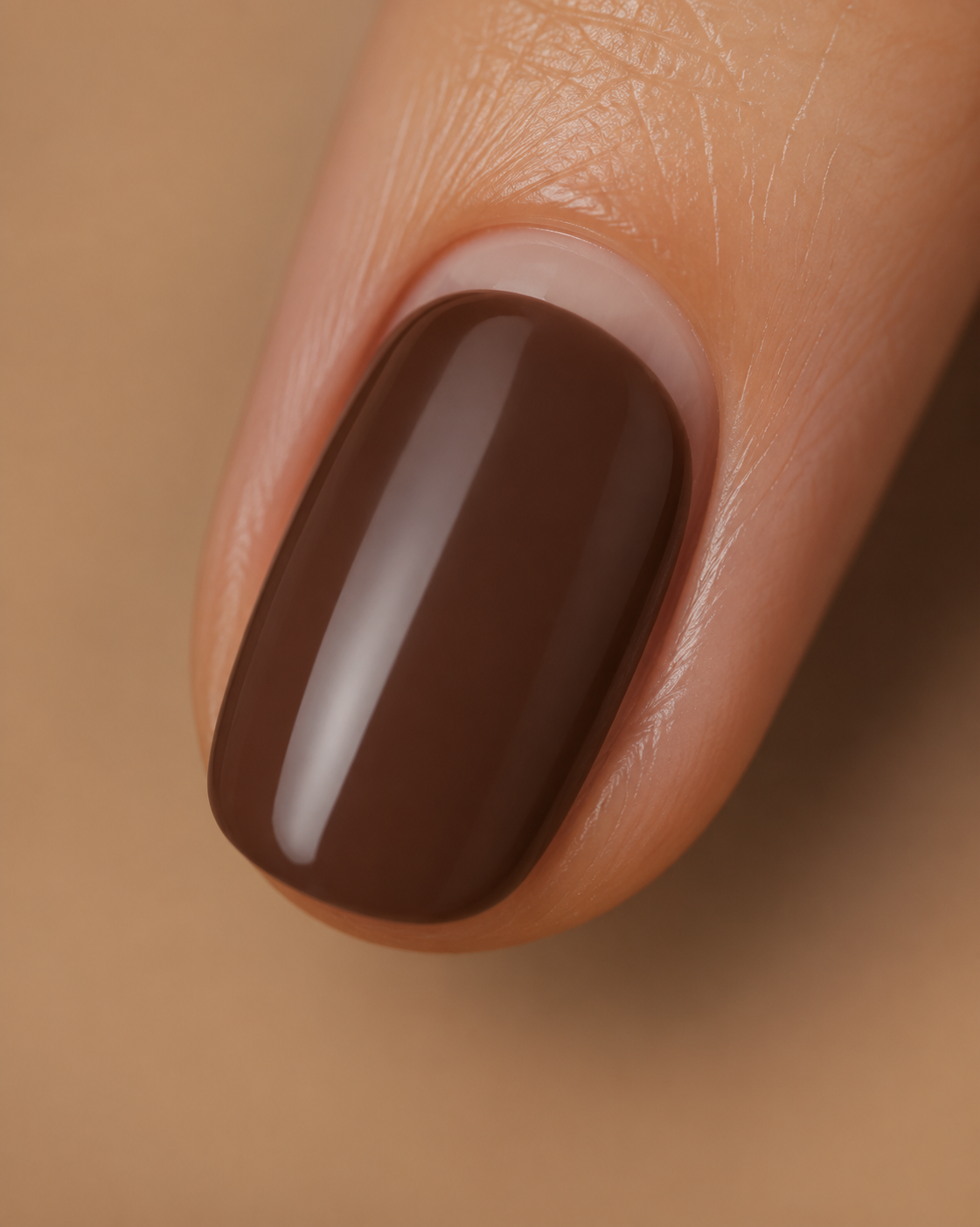 Negative space manicure detail with espresso nail polish and bare cuticle line.
