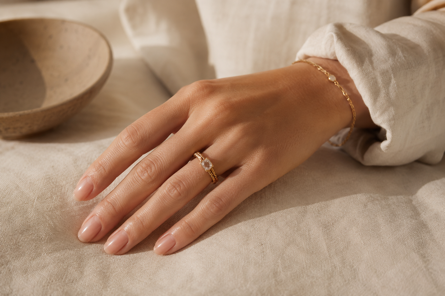 Close-up of elegant, well-maintained hands showing how to fix a hangnail without damaging the surrounding cuticle.