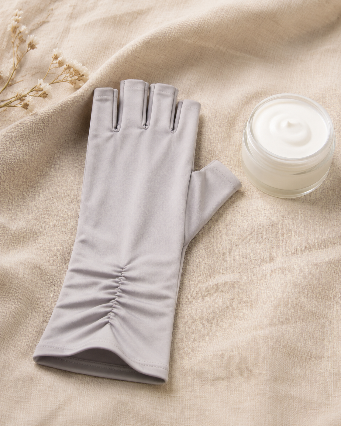 Fingerless UV glove styled with hand cream as part of an at-home manicure routine.