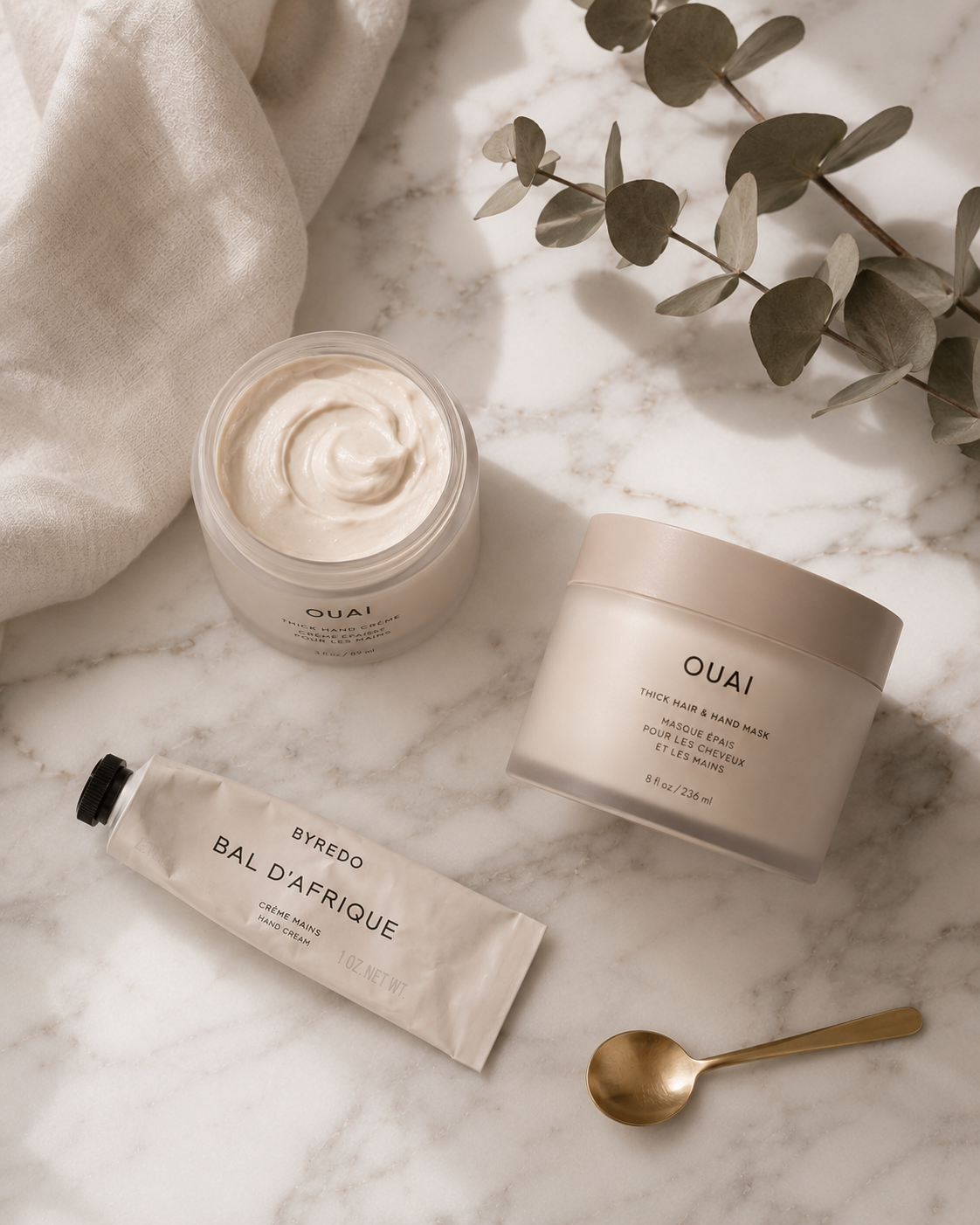 Flat-lay of hand mask and hand cream jars styled for a weekly hand care ritual