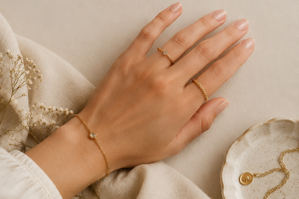 Quiet luxury hand jewelry styling with minimal gold rings and manicure