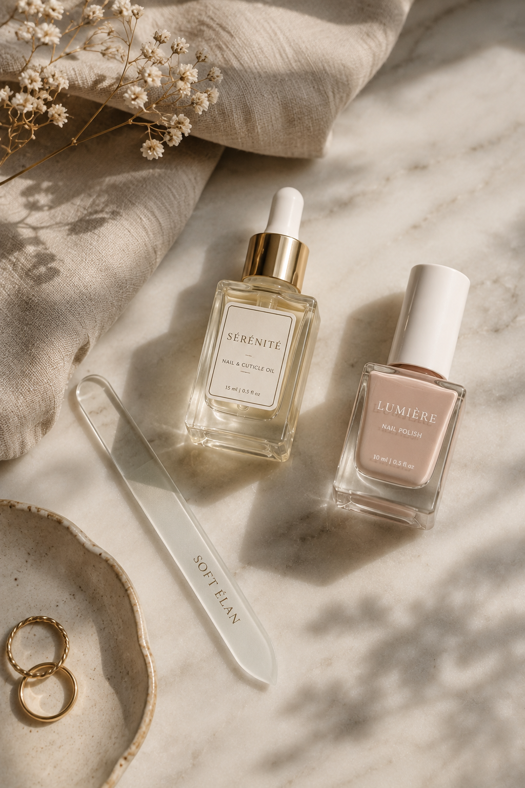 Nail care essentials including a glass nail file and cuticle oil, styled for a healthy nail length maintenance routine.