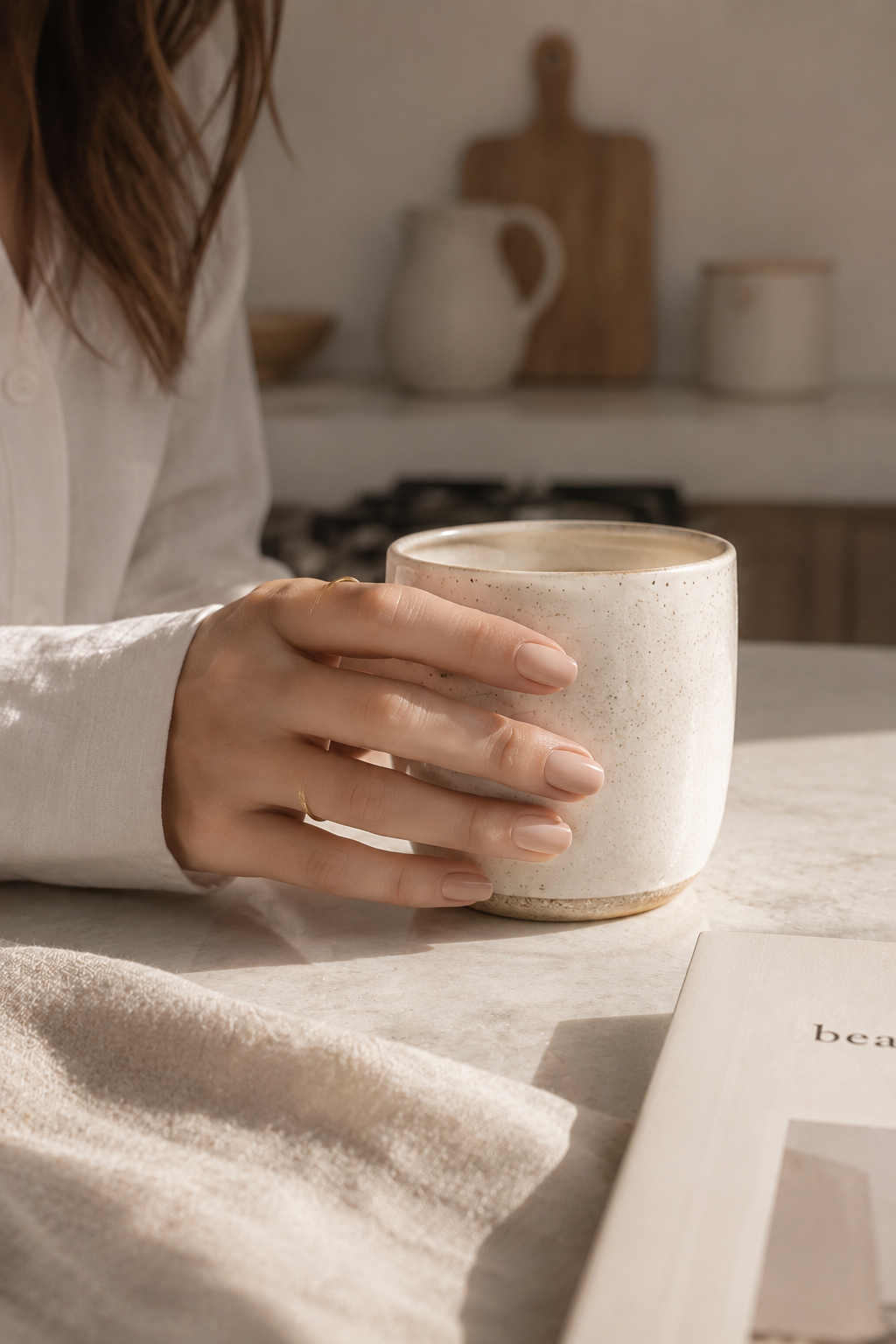 Glossy top coat manicure shown in an everyday lifestyle setting with soft natural light.