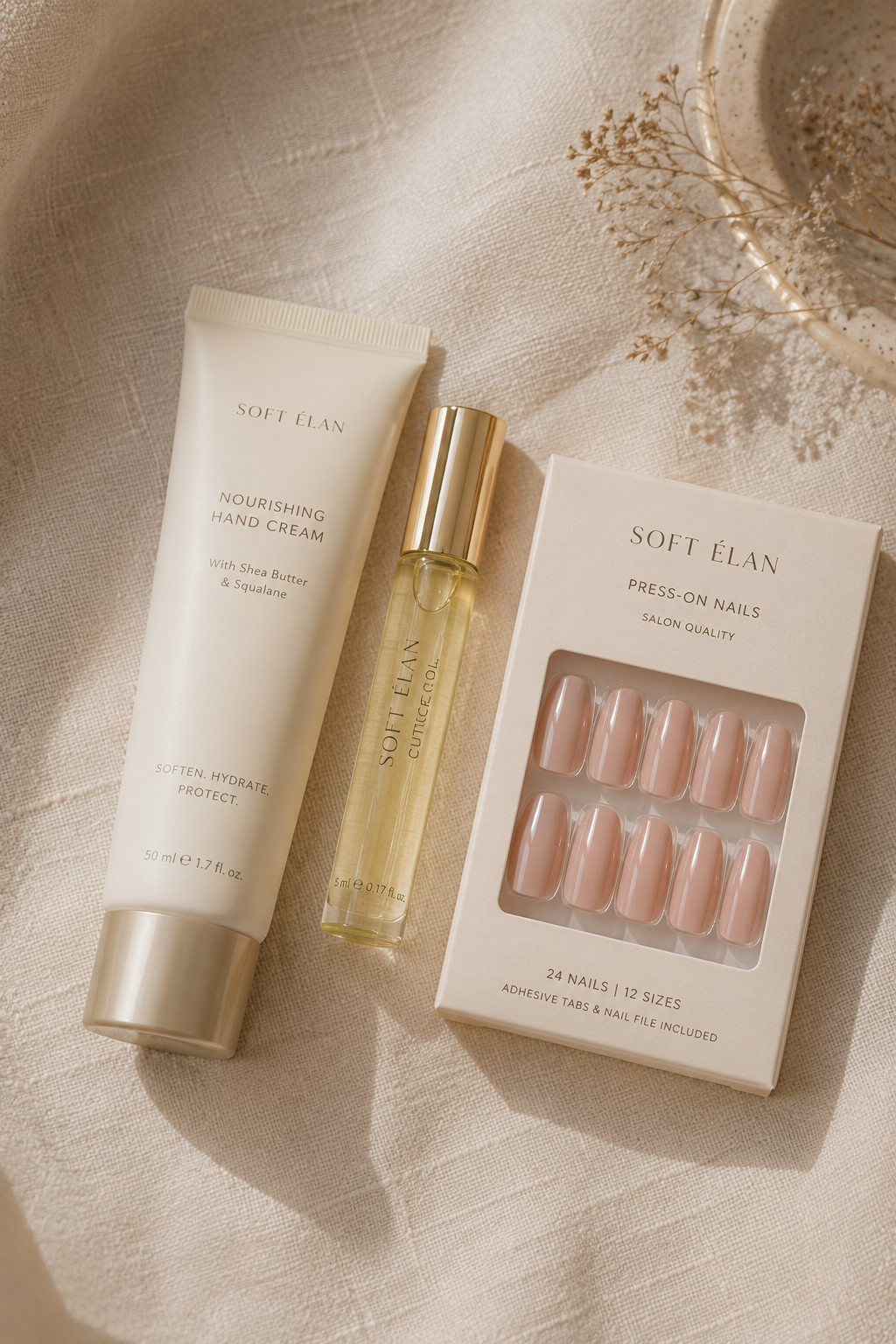 Hand cream, cuticle oil, and press-on nails for a fall bridal manicure routine
